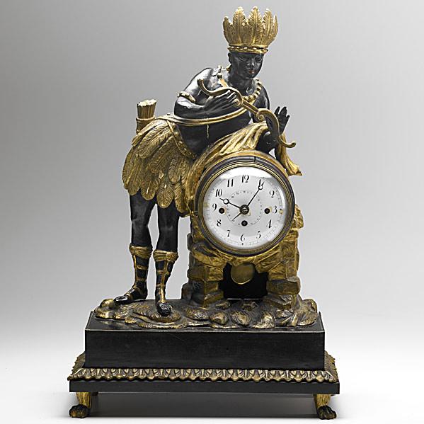 Appraisal: EUROPEAN MANTLE CLOCKCarved wood with a Blackamoor figure in native