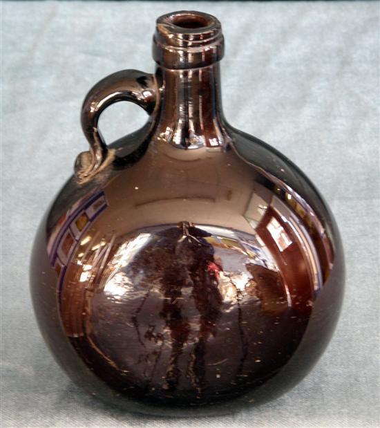 Appraisal: th century hand blown brown glass whiskey bottle of globular