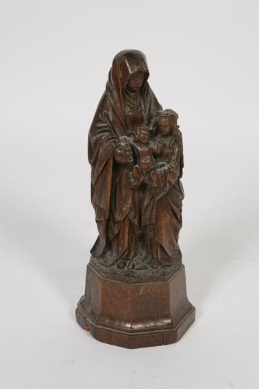 Appraisal: A FLEMISH OAK CARVING of St Anna Seldritt mounted on