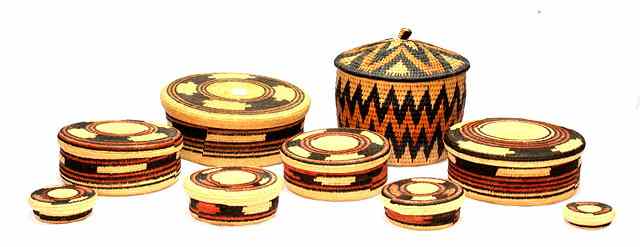 Appraisal: A GRADUATED SET OF AFRICAN TRIBAL INTERFITTING BASKETS AND COVERS