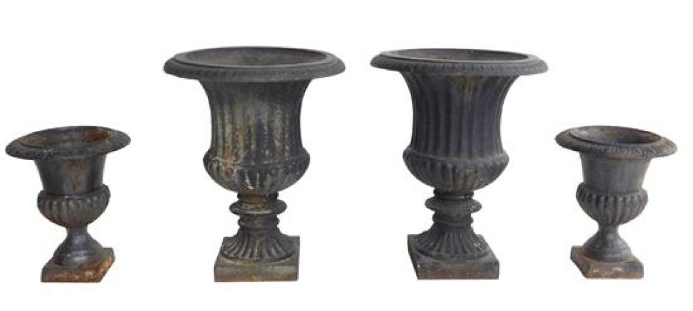 Appraisal: Four iron garden urns two sizes in matching classical style