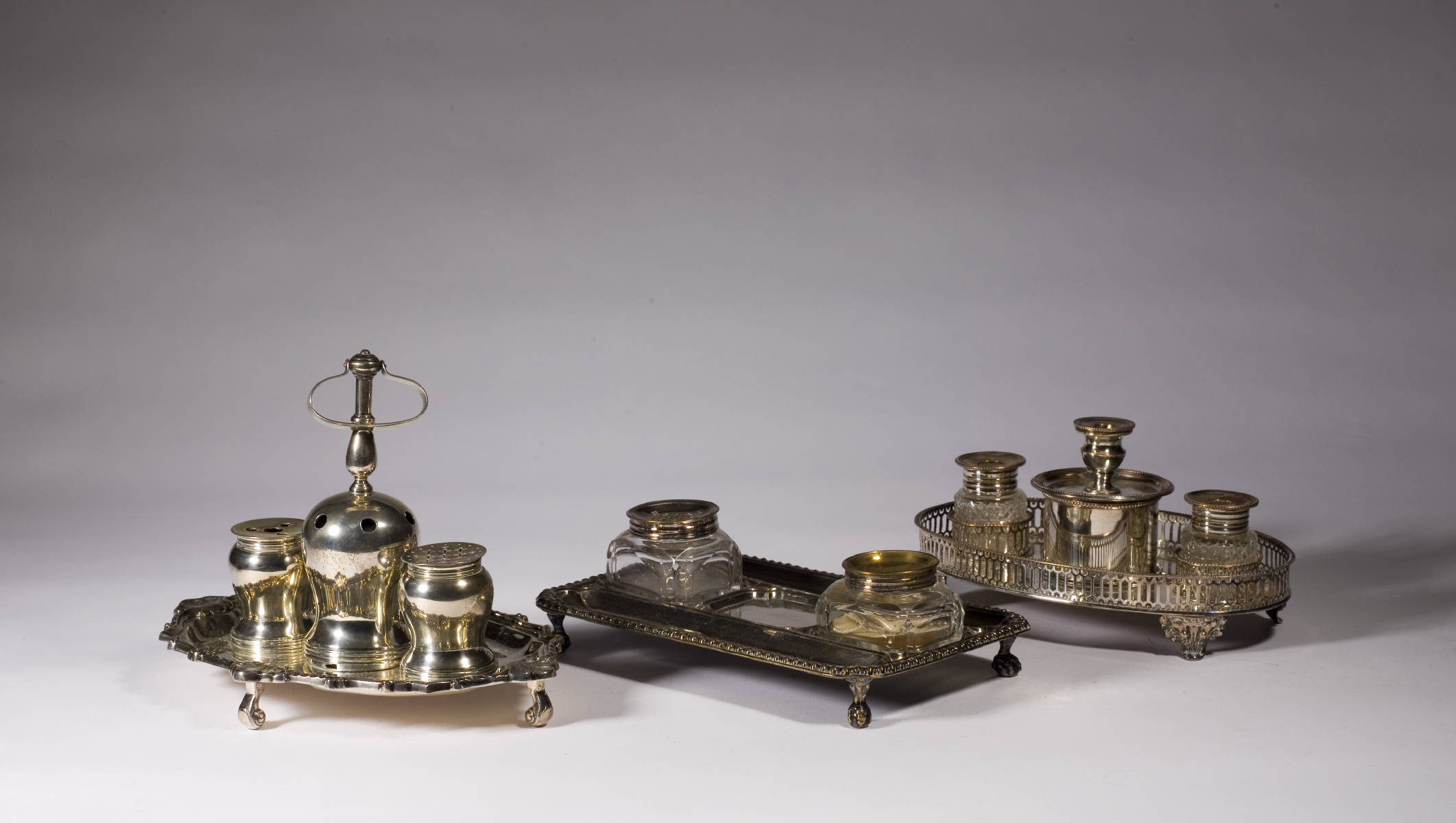 Appraisal: THREE ENGLISH SILVERPLATE AND CRYSTAL INKSTANDS Length of largest inches