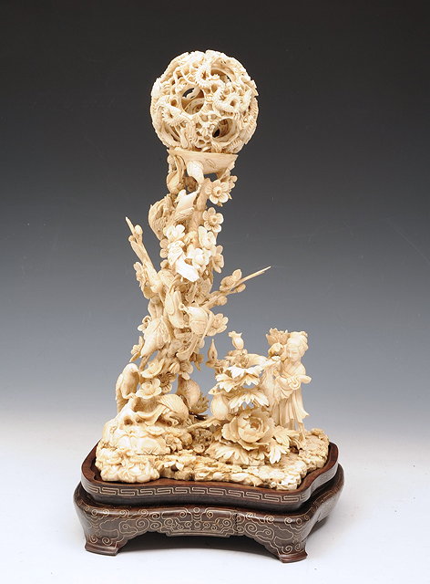 Appraisal: AN IVORY GARDEN SCENE Canton with concentric dragon carved balls