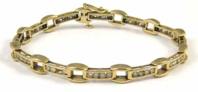 Appraisal: DIAMOND AND FOURTEEN KARAT GOLD BRACELET inches in length and