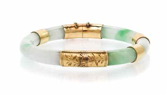 Appraisal: A Yellow Gold and Jade Hinged Bangle Bracelet consisting of