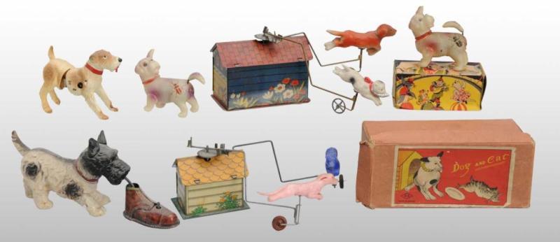 Appraisal: Lot of Celluloid Dog Wind-Up Toys Description Japanese Working All