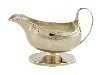 Appraisal: A GEORGE III SAUCE BOAT with reeded rim and handle