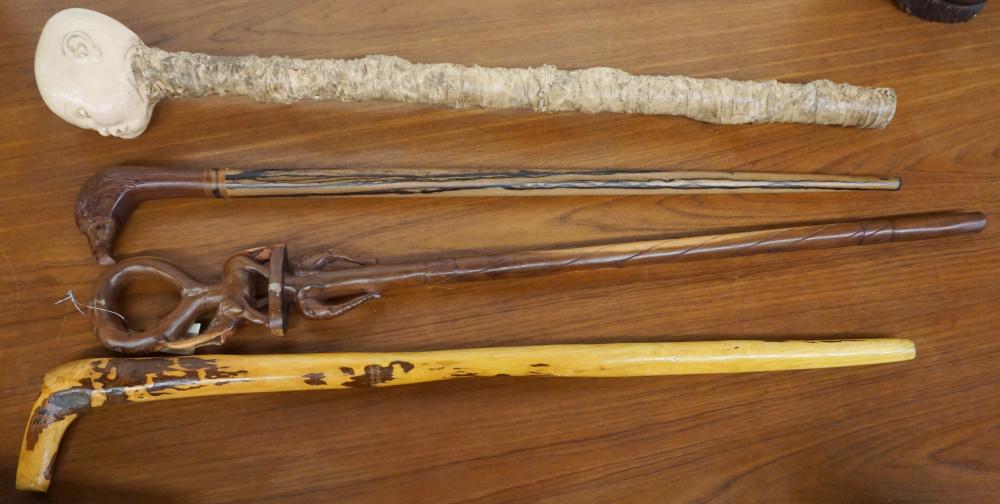 Appraisal: COLLECTION OF FOUR ASSORTED WALKING STICKS CANESCollection of Four Assorted