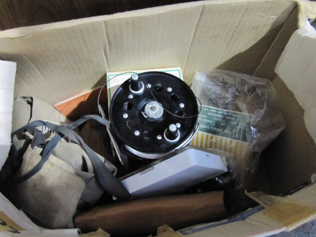 Appraisal: Lot comprising fishing rod and a box of reels and