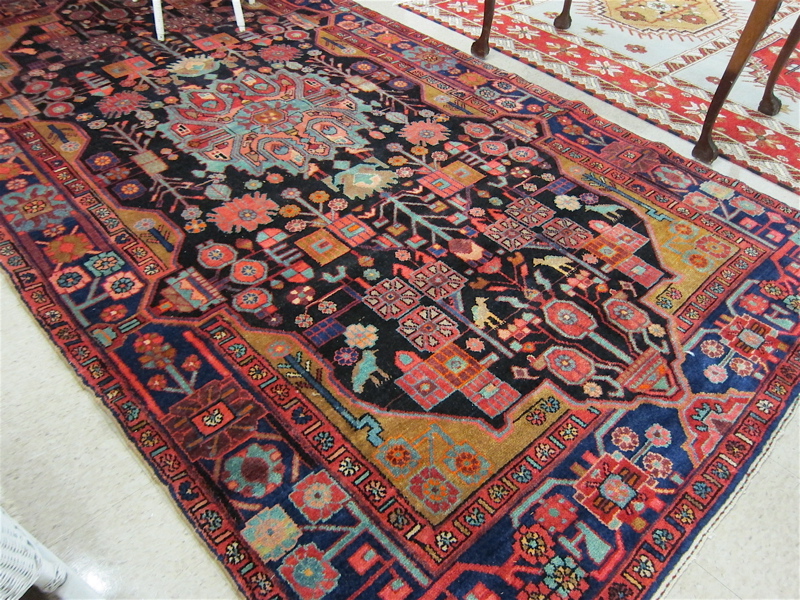 Appraisal: PERSIAN HAMADAN TRIBAL CARPET central medallion and stylized floral design