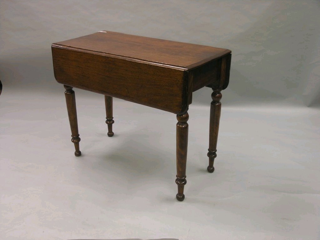 Appraisal: A Victorian mahogany Pembroke table with single frieze drawer on