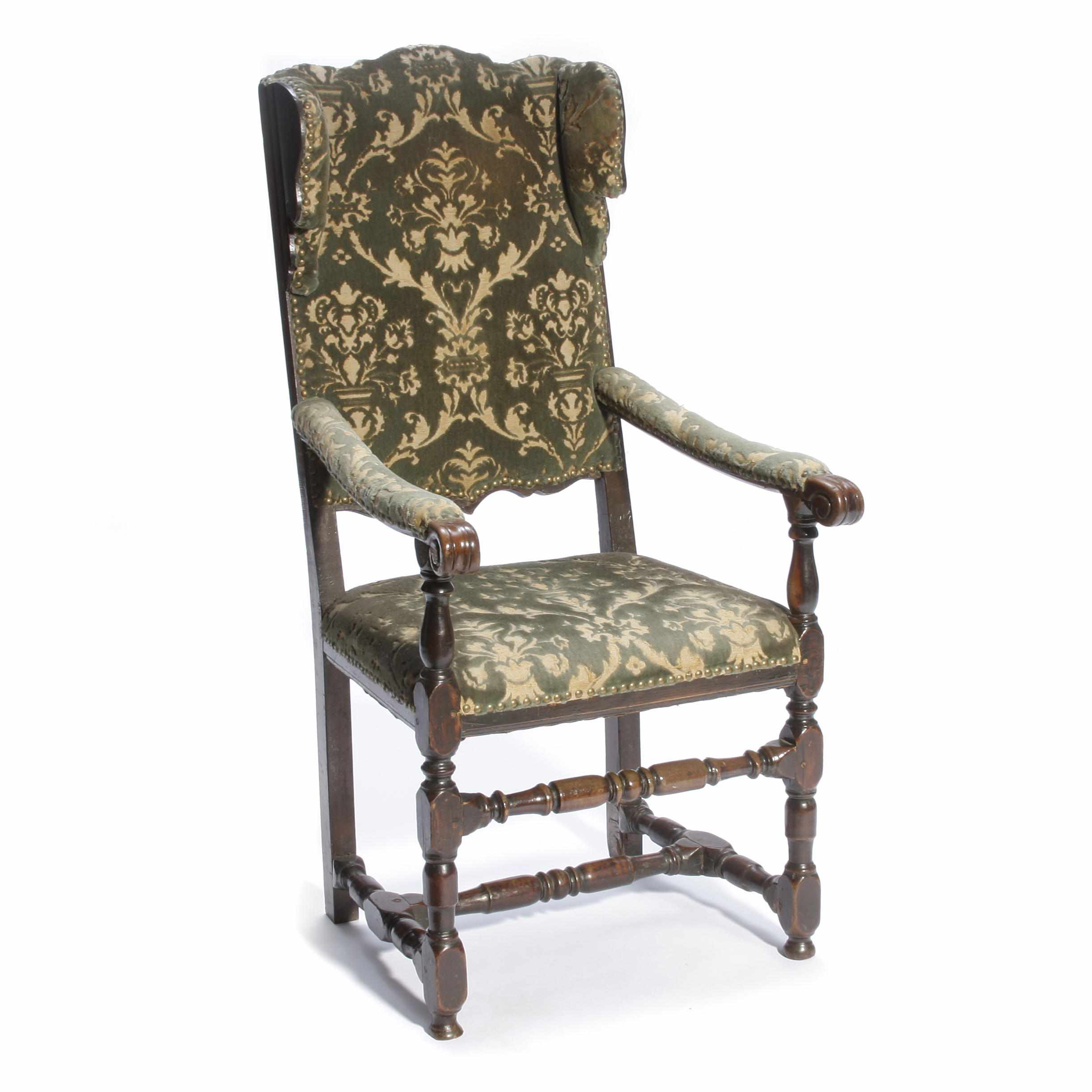 Appraisal: An Austrian Baroque fruitwood armchair th century with alterationsheight in