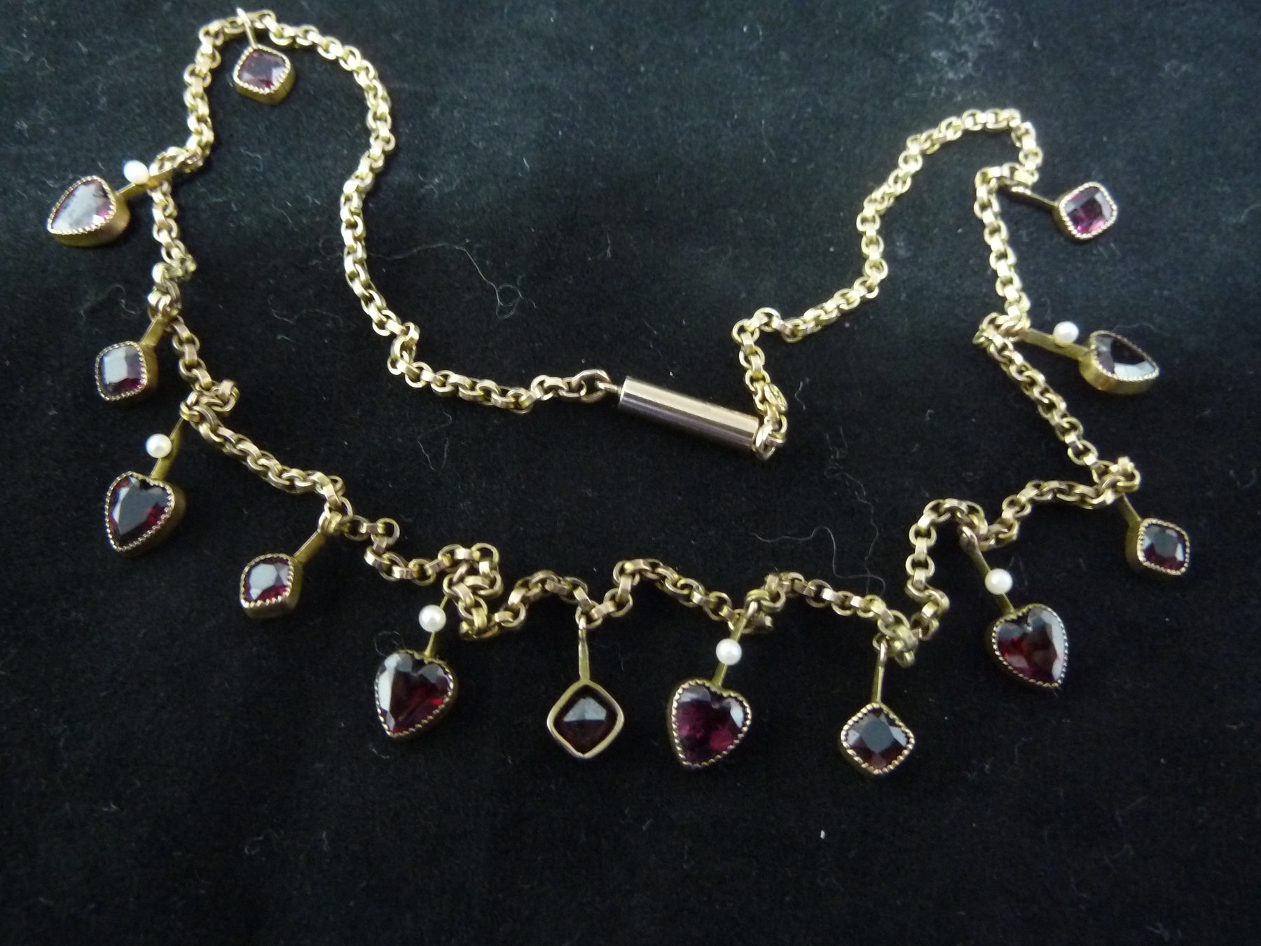 Appraisal: A pearl and garnet necklace the ct gold chain hung