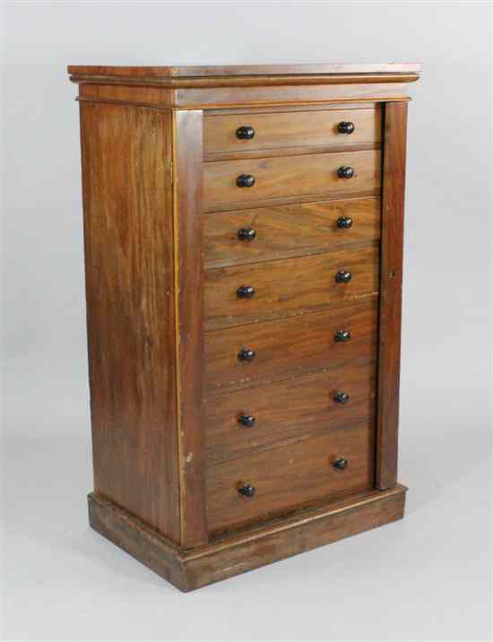 Appraisal: A late Victorian mahogany Wellington chest with seven graduated drawers