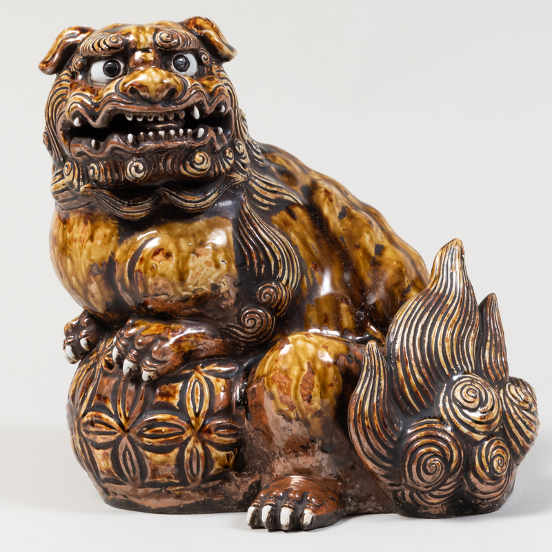 Appraisal: Japanese Brown Glased Earthenware Figure of a Buddhistic Lion Unmarked