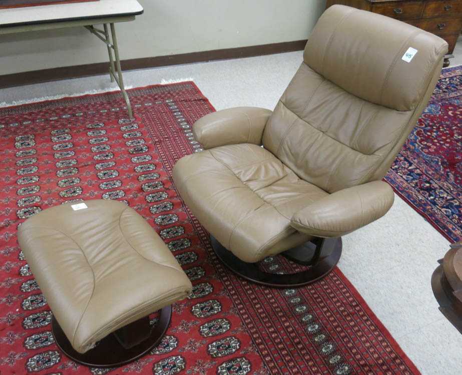 Appraisal: MODERN LEATHER RECLINING LOUNGE CHAIR WITH MATCHING FOOTSTOOL Ekornes retro