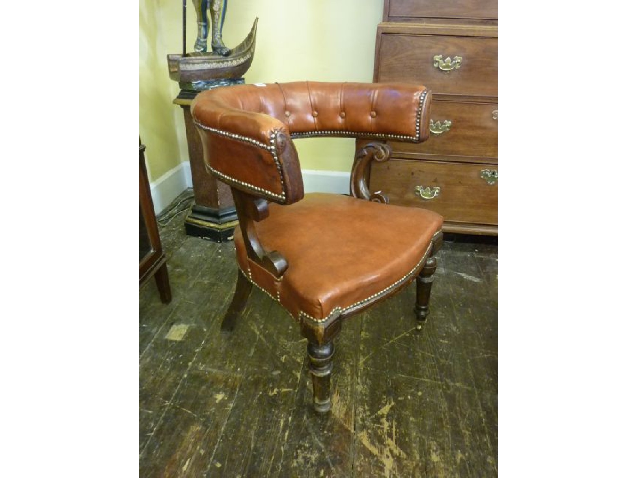 Appraisal: A Victorian mahogany library chair with horse shoe shaped back