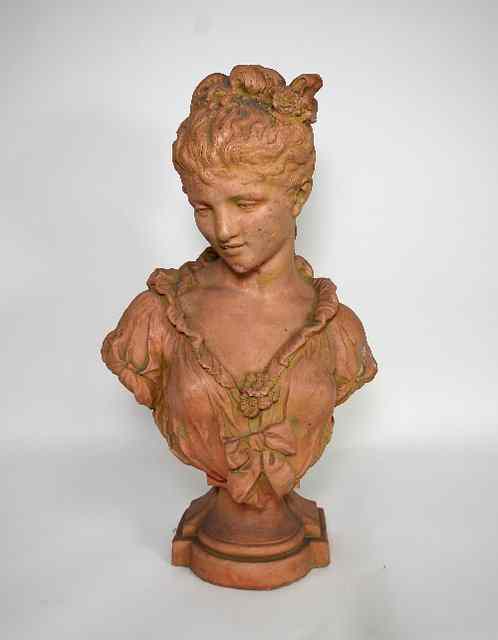 Appraisal: A late th Century terracotta bust of a girl Mignon