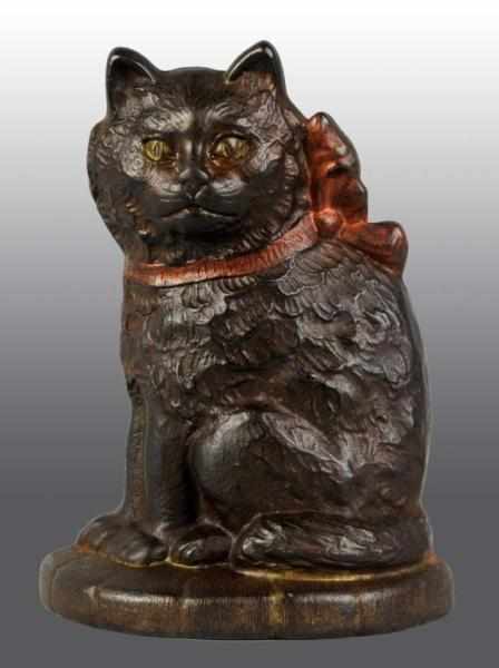 Appraisal: Cast Iron Cat with Bow on Pillow Doorstop Description Marked