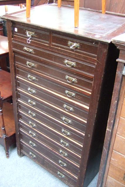 Appraisal: A late Victorian oak clerk's Wellington chest with a hinged