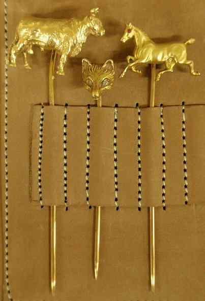 Appraisal: Three animal figural stickpins k yg including a bull a