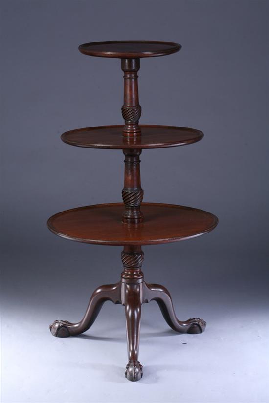 Appraisal: GEORGIAN MAHOGANY THREE-TIER DUMBWAITER th century Molded-lip edge columnar spiral-twist