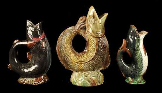 Appraisal: Three various majolica fish jugs including a Portuguese example cm