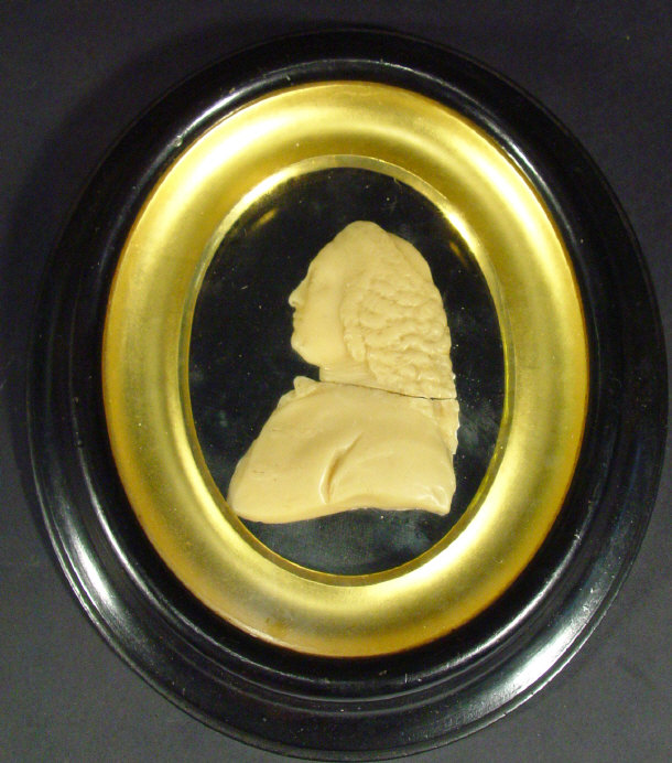 Appraisal: Wax portrait of a gentleman in a gilt and ebonised