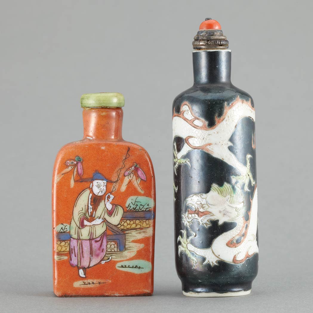 Appraisal: Two Chinese Enameled Porcelain Snuff Bottles th th Century Comprising