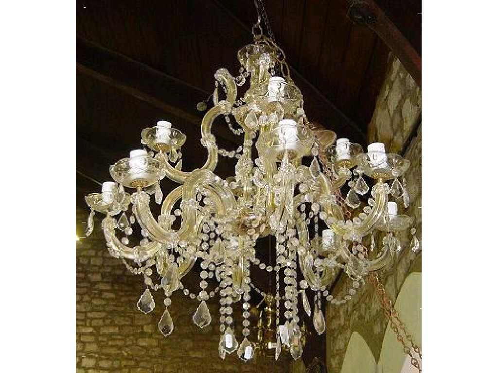 Appraisal: A cut glass branch chandelier on two tiers with further