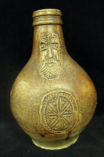 Appraisal: A German saltglazed bellamine flask the neck moulded a mask