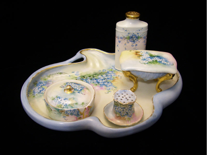 Appraisal: pc Porcelain Dresser Set Hand painted porcelain on various blanks