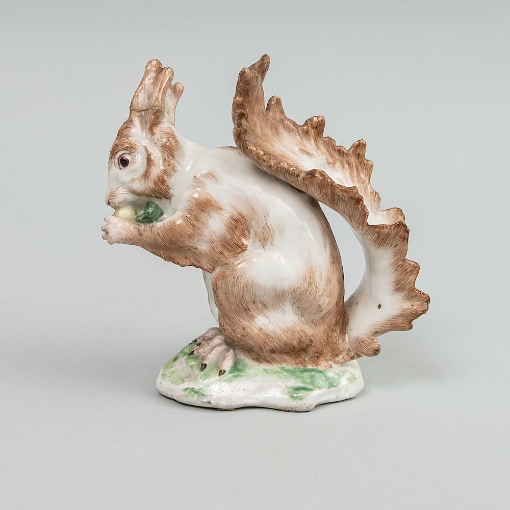 Appraisal: English Porcelain Model of a Squirrel Eating a Nut Possibly