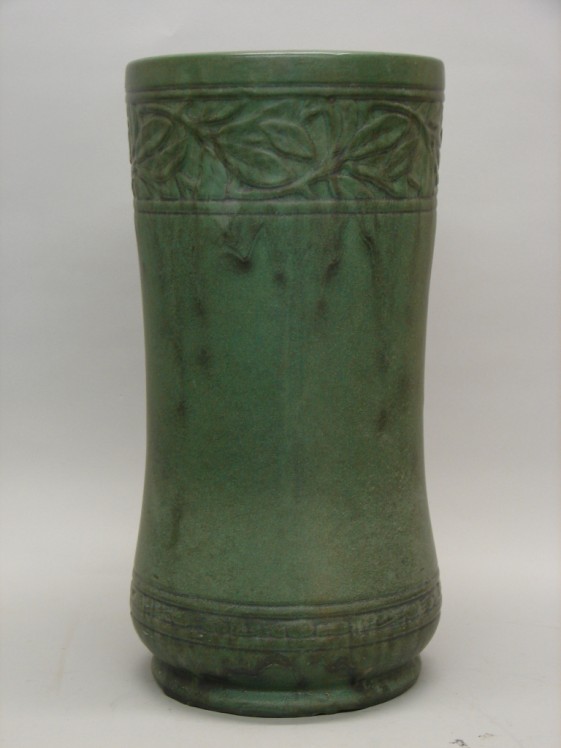 Appraisal: Umbrella stand with molded design under a matte green glaze