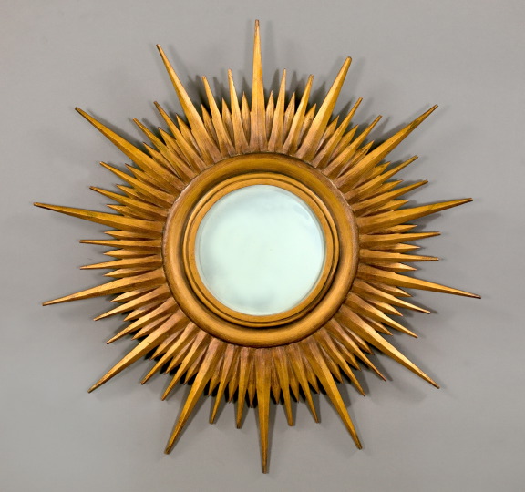 Appraisal: Large Italian Matte Deux-Couleur-Gilded Wooden Sunburst Looking Glass in the