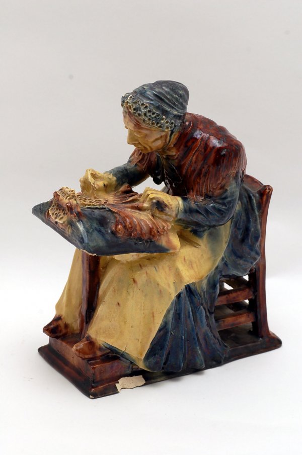 Appraisal: Figurine of a woman lacemaking unsigned MEASUREMENTS CONDITION chip to