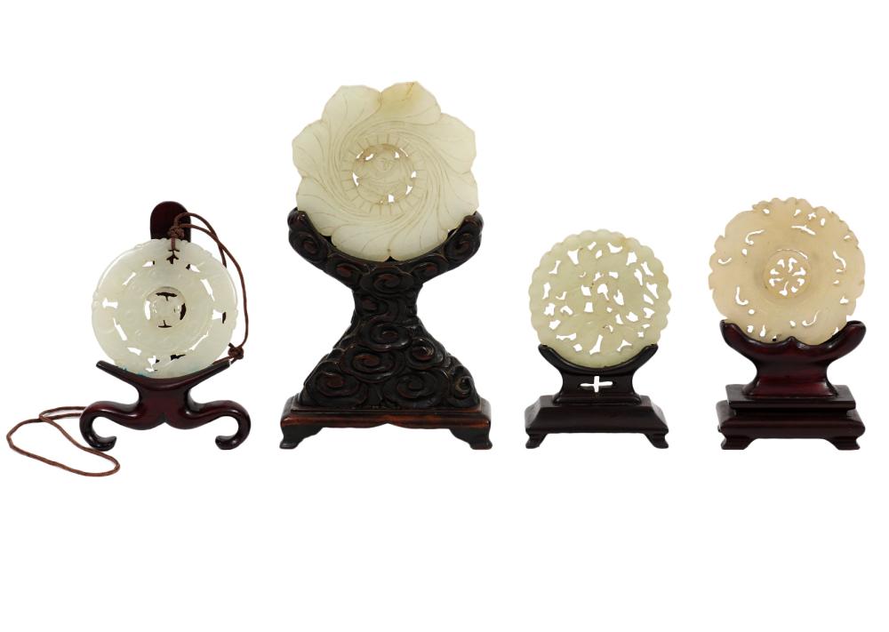 Appraisal: JADE CARVED DISCS IN WOOD STANDS assorted Chinese carved jade