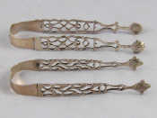 Appraisal: Two pairs of Georgian silver cast pierced sugar tongs with