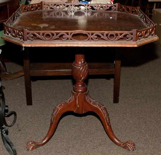 Appraisal: Chippendale style mahogany tea table with pierced wood gallery Estimate