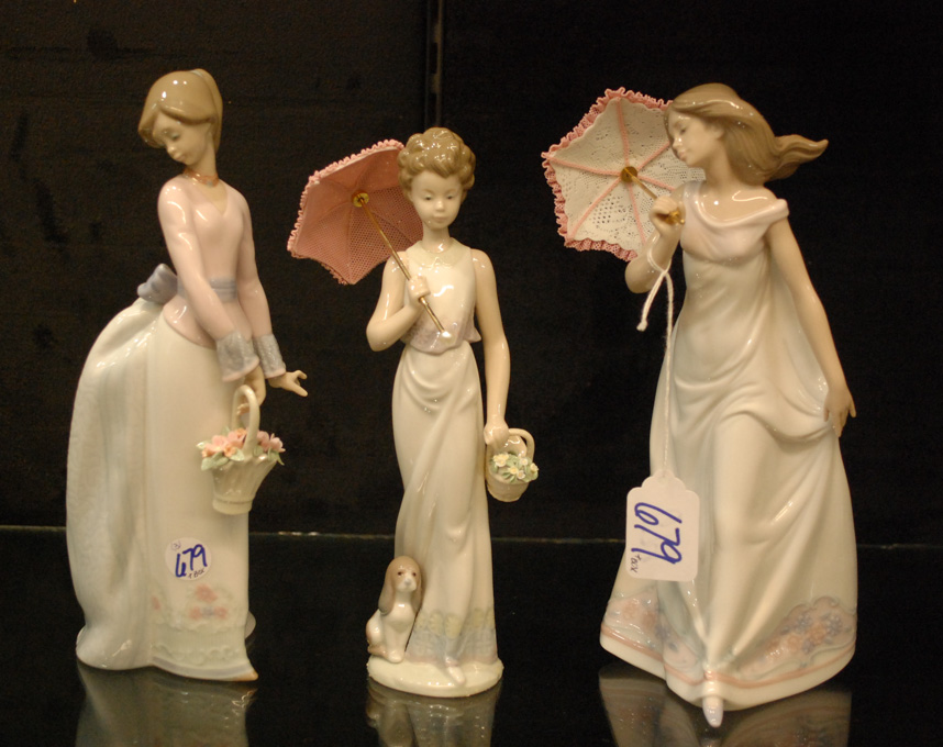 Appraisal: THREE LLADRO PORCELAIN FIGURINES Garden Classic issued sculptor Juan Huerta