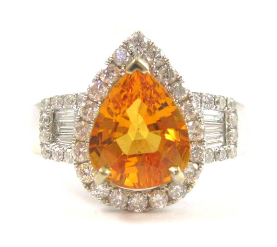 Appraisal: ORANGE SAPPHIRE AND DIAMOND RING The k white gold ring