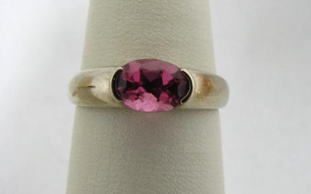 Appraisal: k white ring with oval rhodolite and garnet SRP- -