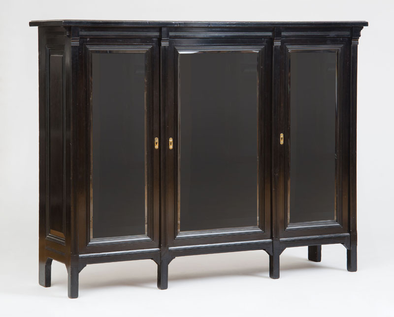 Appraisal: HERTER BROTHERS THREE-DOOR BOOKCASE Ebonized finish branded signature x x