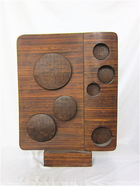 Appraisal: LAMINATE WOOD SCULPTURE American th century featuring protruding circles and