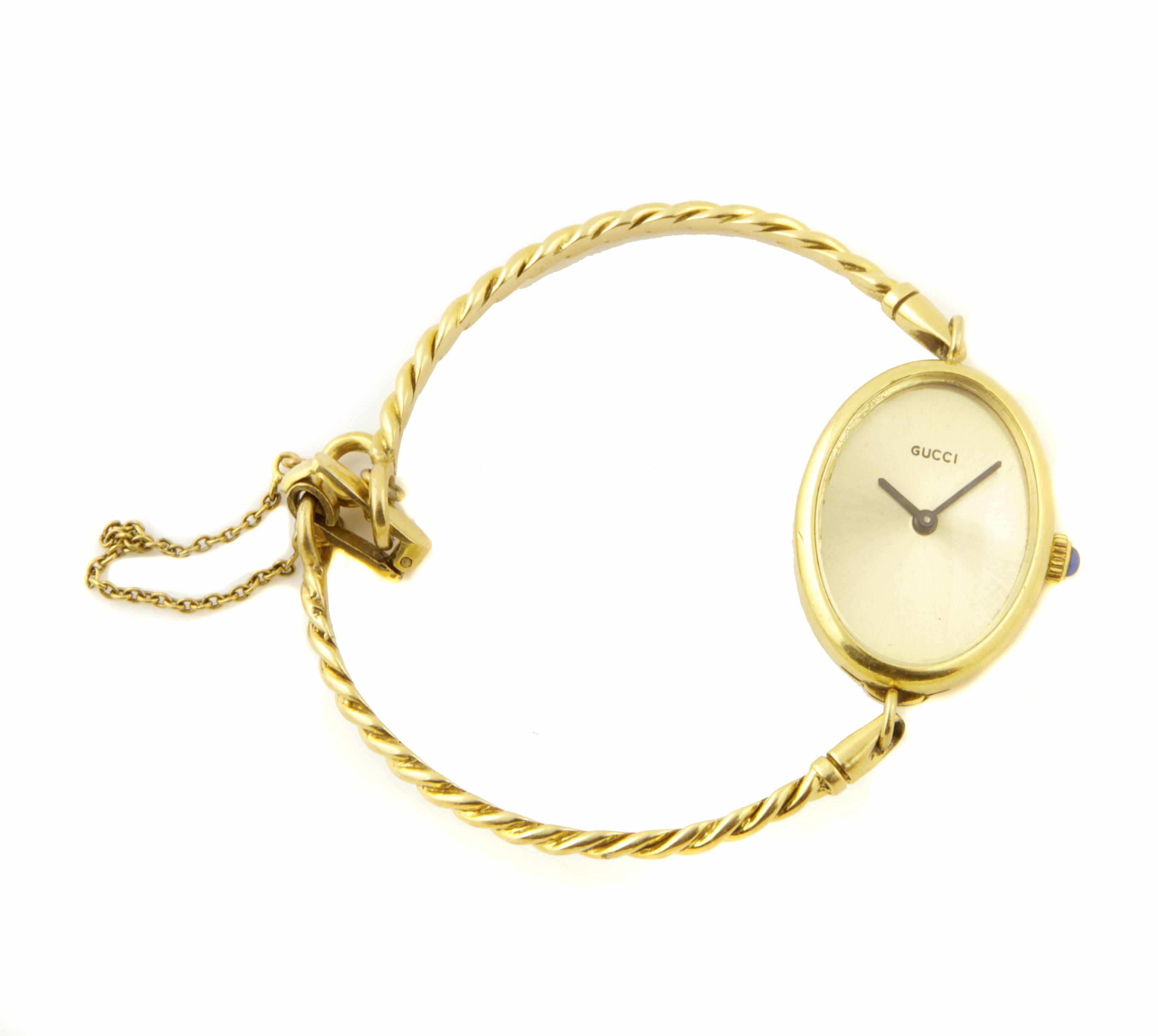 Appraisal: A lady's gold bangle wristwatch dial signed Gucci g gross