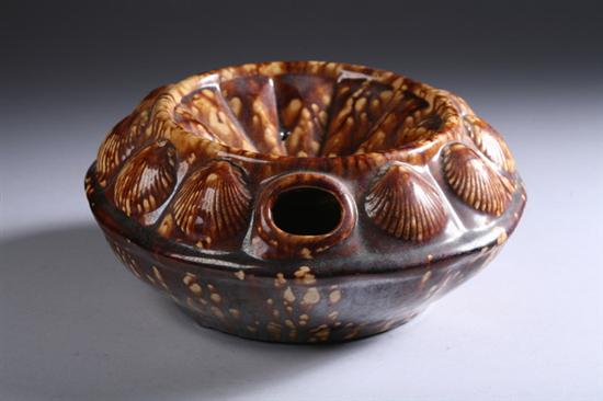 Appraisal: BENNINGTON-STYLE BROWN DRIP-GLAZED POTTERY SPITTOON early th century Border of