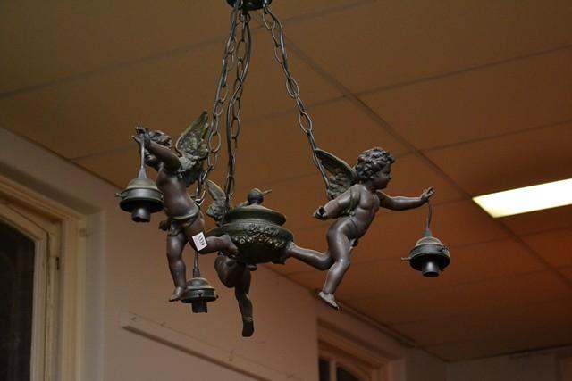 Appraisal: A PAIR OF CUPID-THEMED THREE BRANCH CHANDELIERS