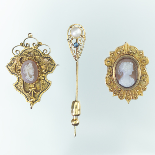 Appraisal: Two Victorian hardstone cameo and k gold pins together with