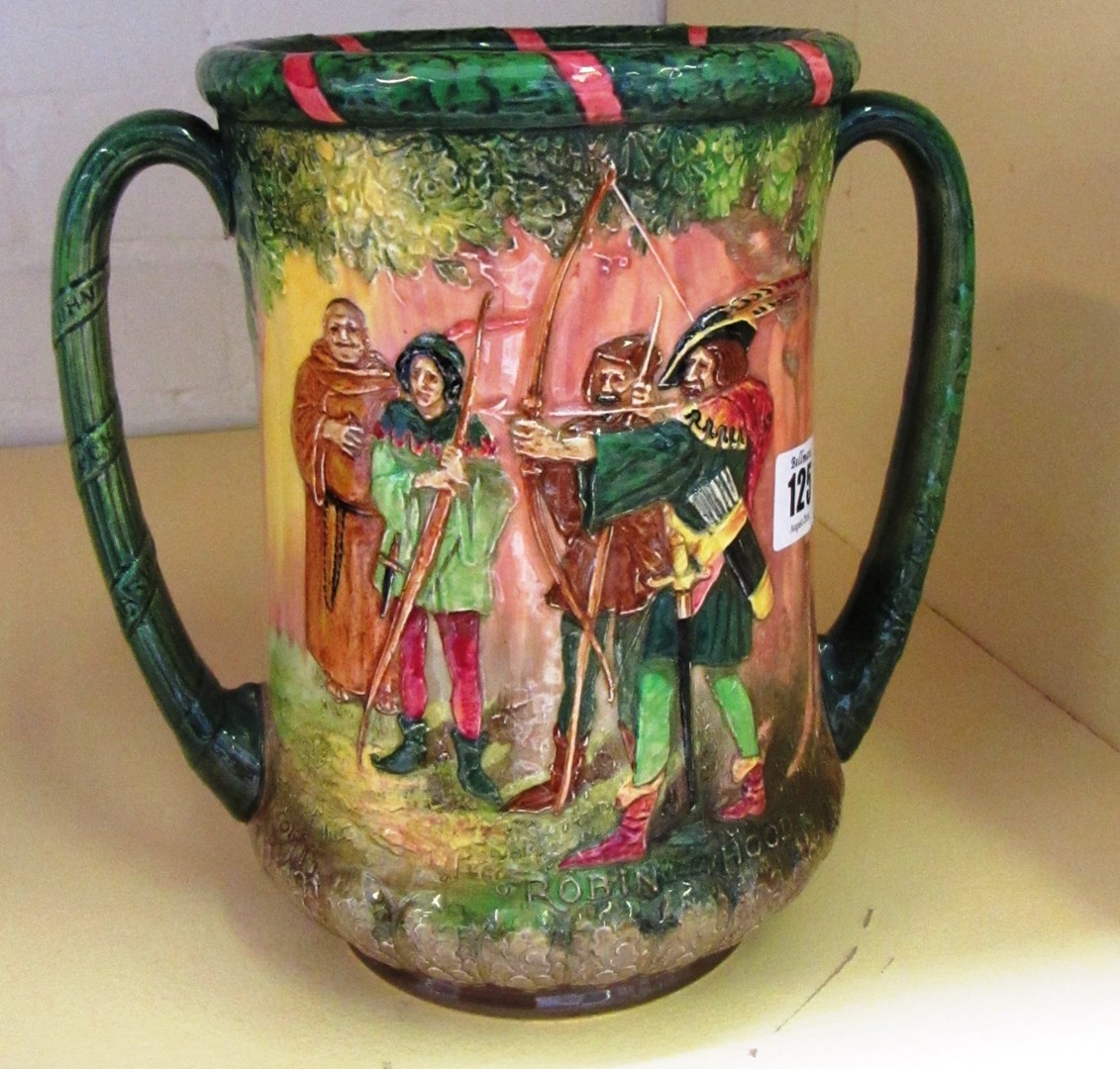 Appraisal: A Royal Doulton loving cup by Charles Noke 'Robin Hood'