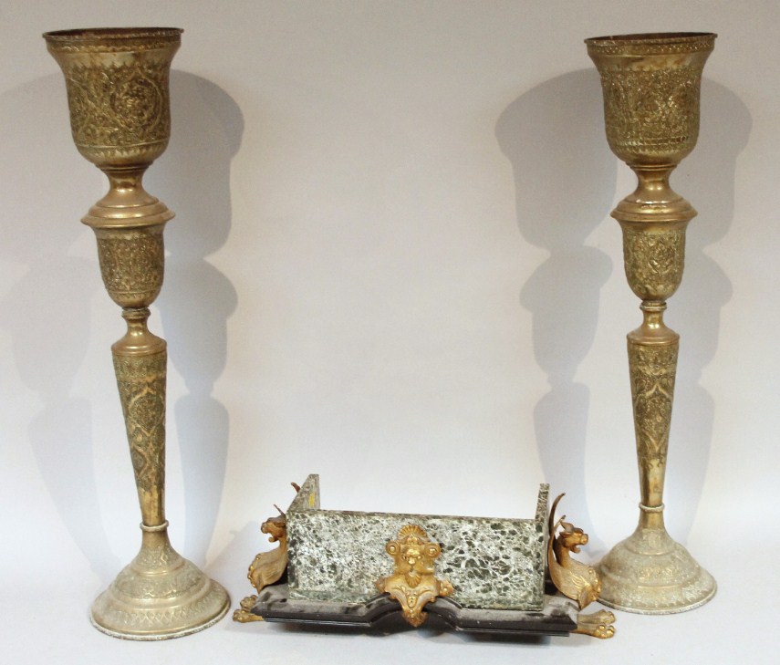 Appraisal: A pair of ecclesiastical style brass candlestick vases with heavy